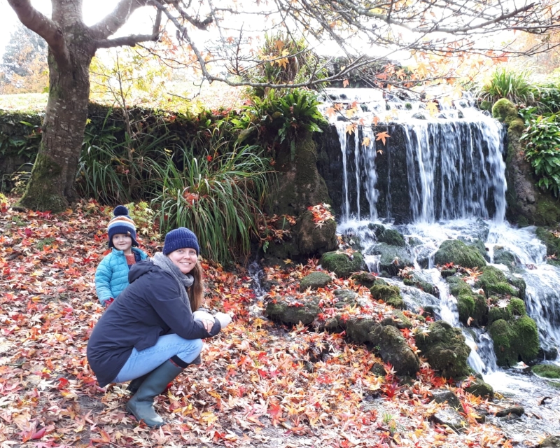 Claire Shaw and her son Emerson by small waterfall and river