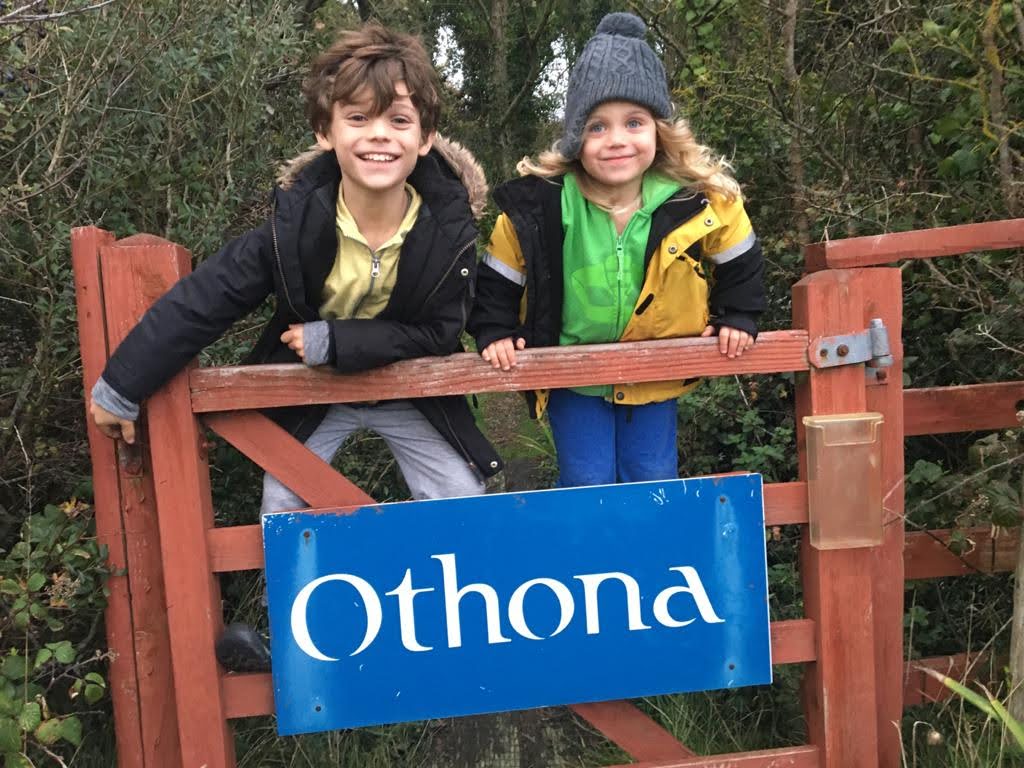 Woodland gate to Othona with two happy children