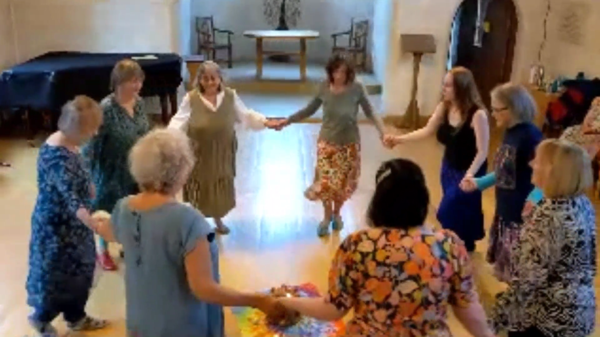 A circle of women dancing in the chapel