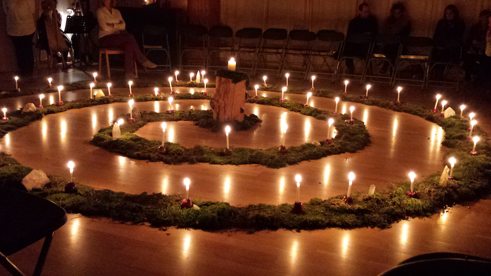Spiral of candles on chapel floor