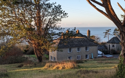 View of Community House with the sea in the background