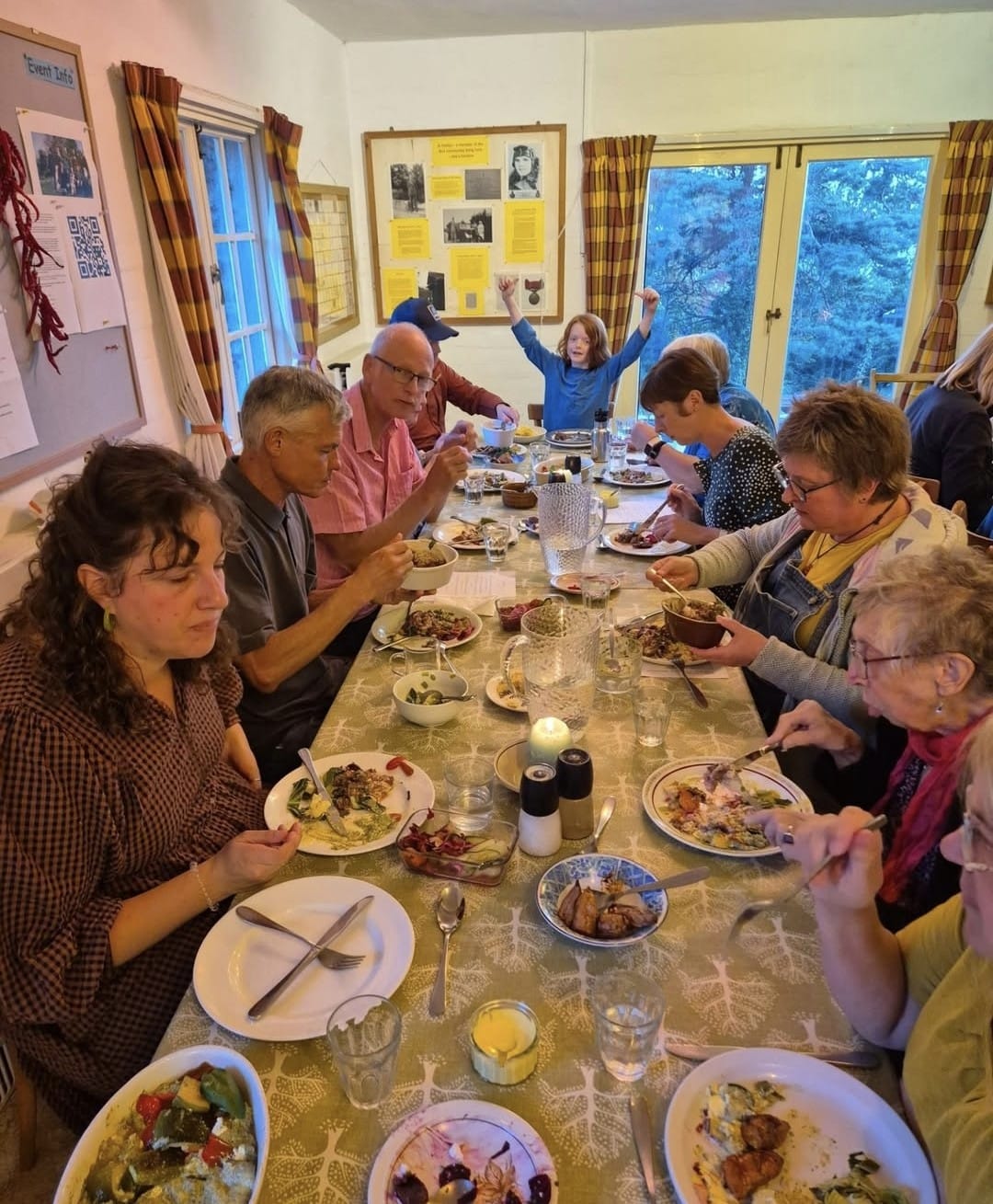 Suus Gooch and others tucking in to an Othona feast